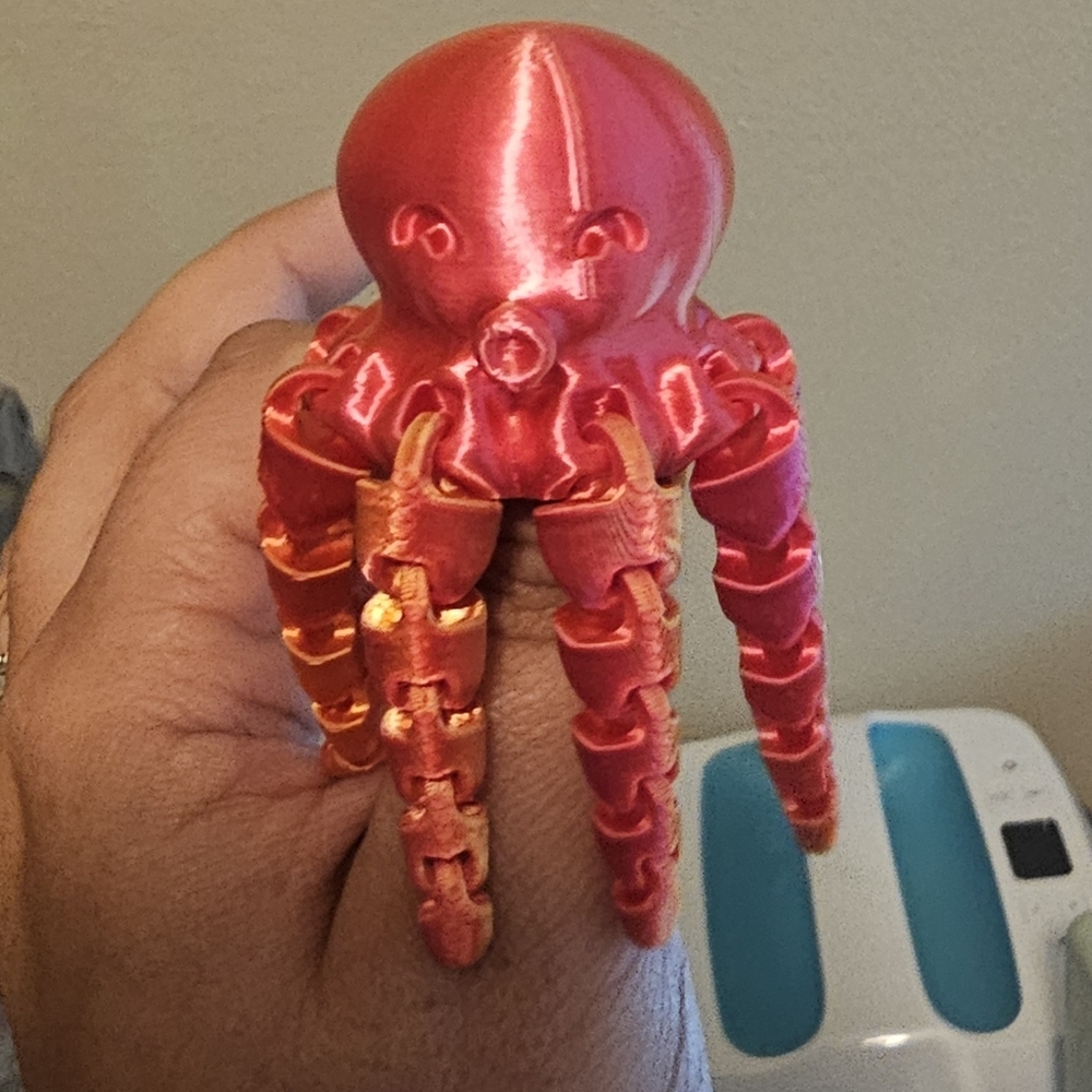 Red and Orange Articulated Octopus Toy
